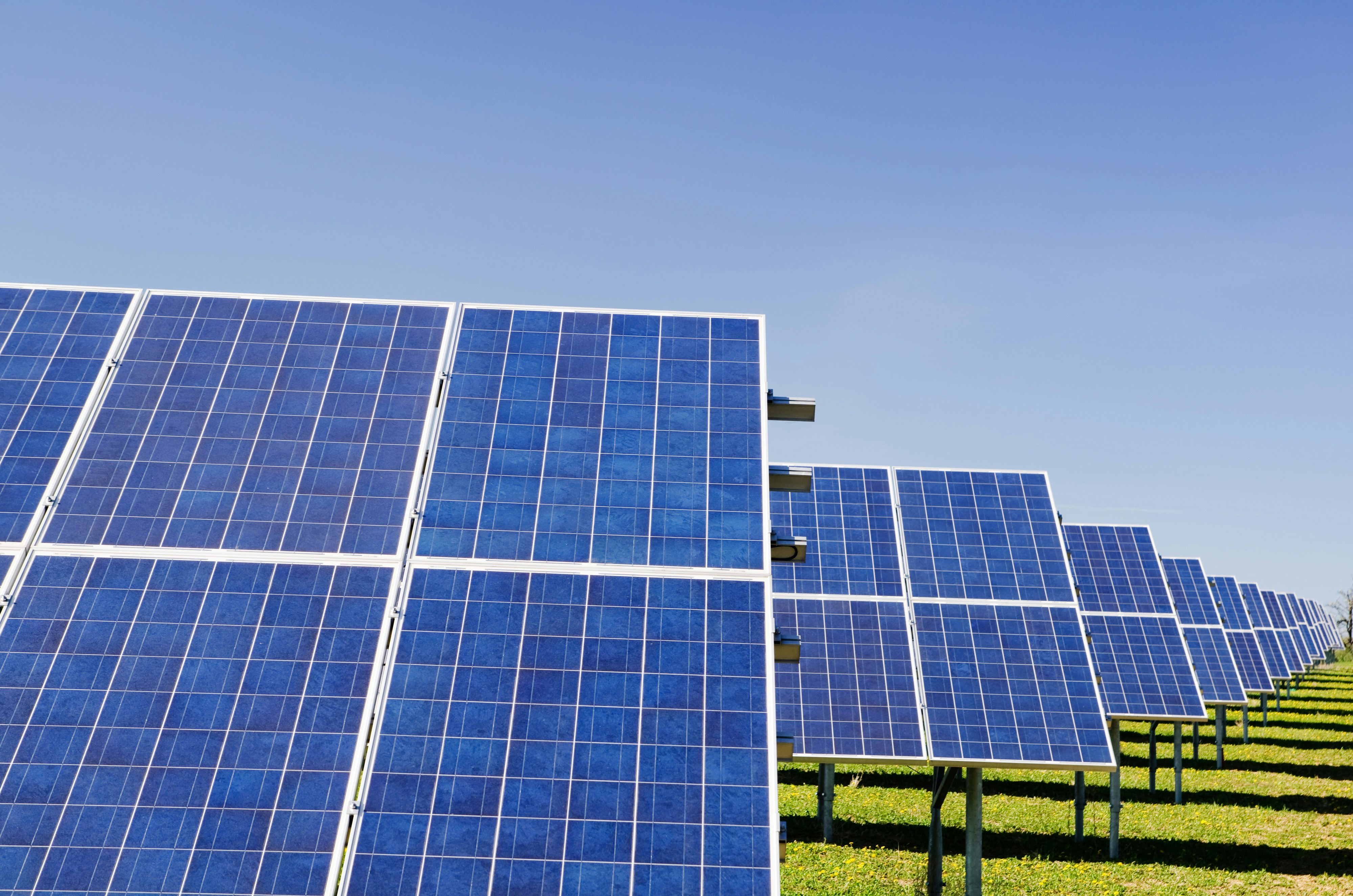 Solar power plant by Gone Greenish blue solar panel boards