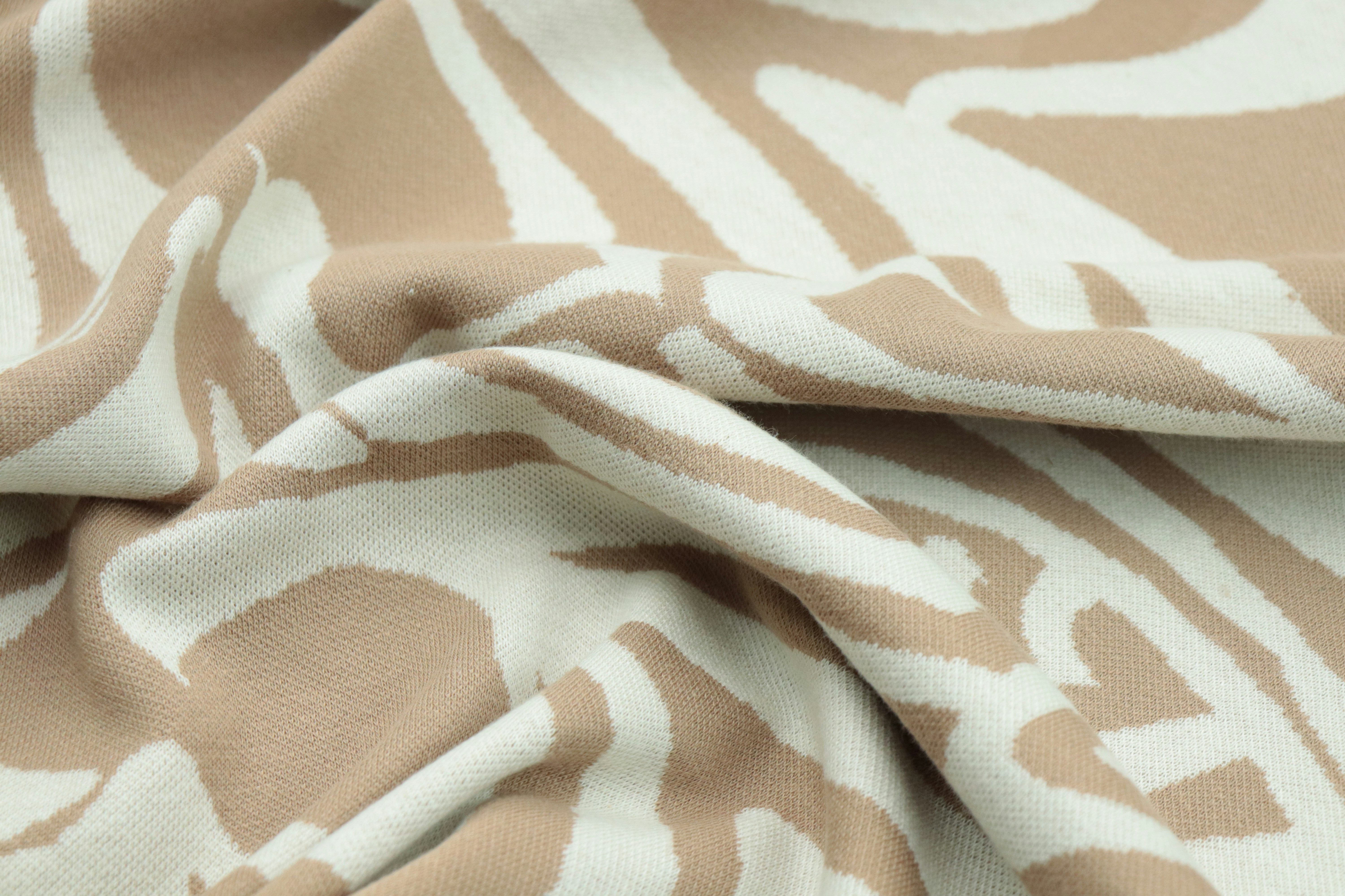 a close up of a brown and white fabric