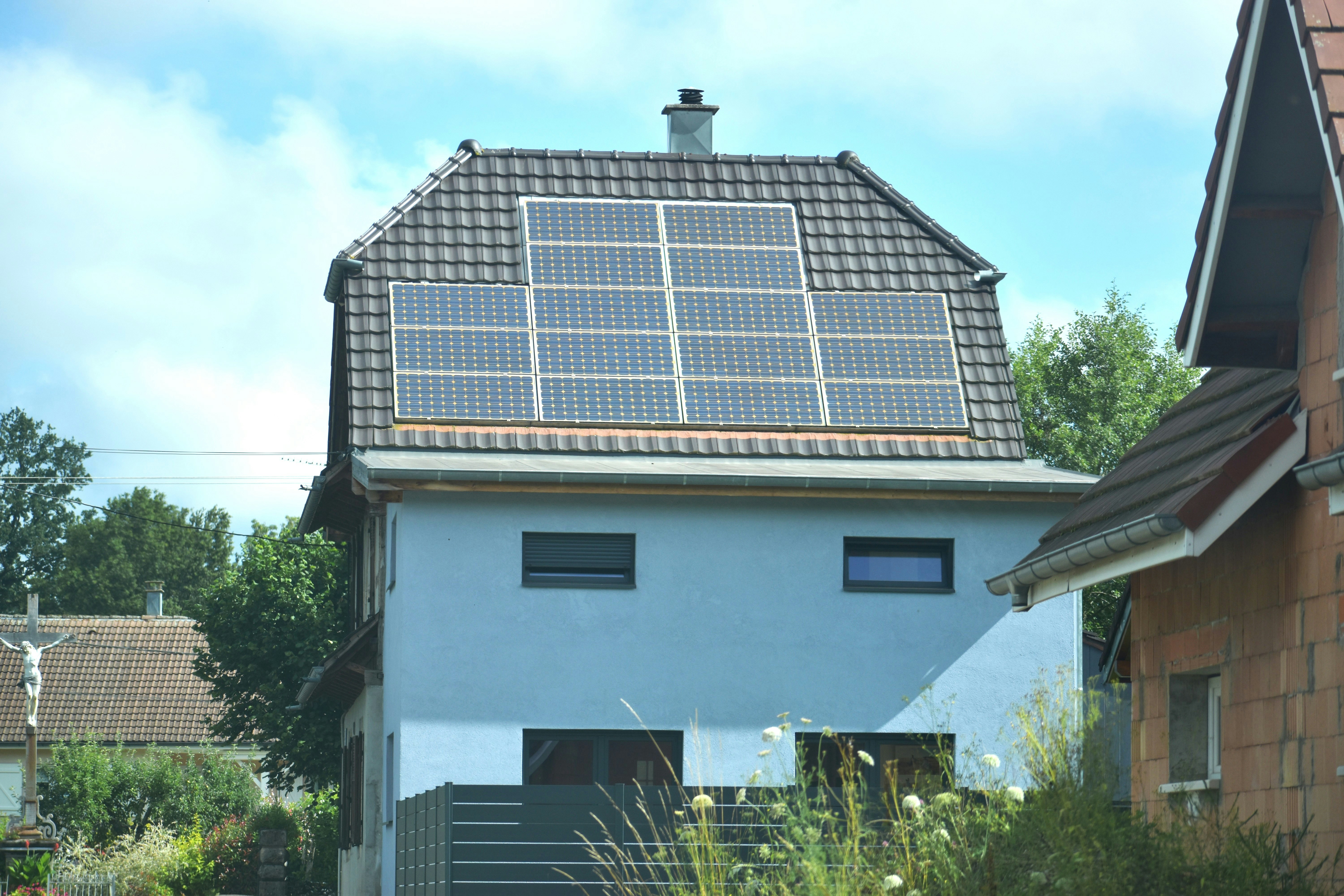 A house with a solar panel on the roof