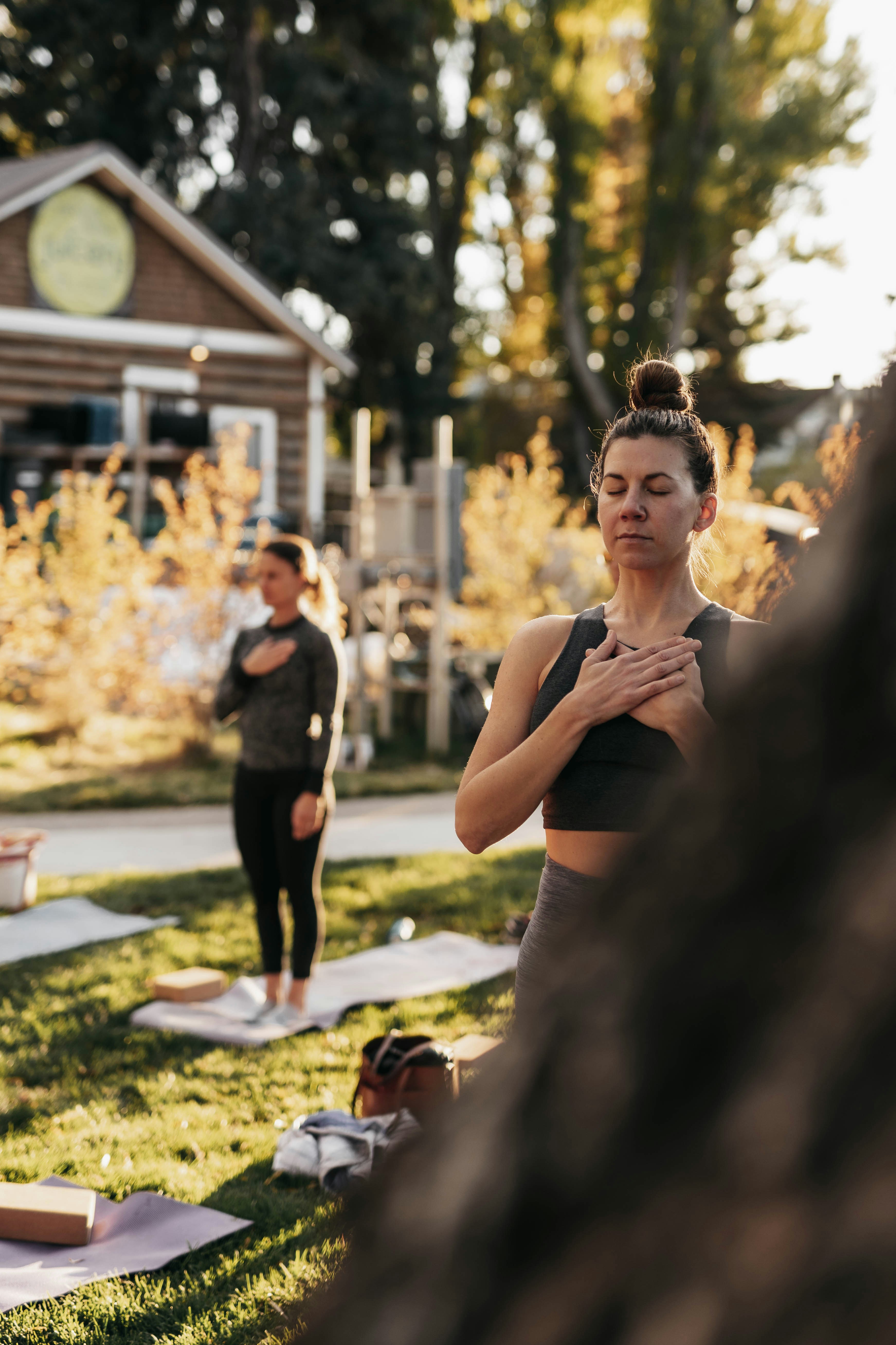 a group of people doing yoga in a park