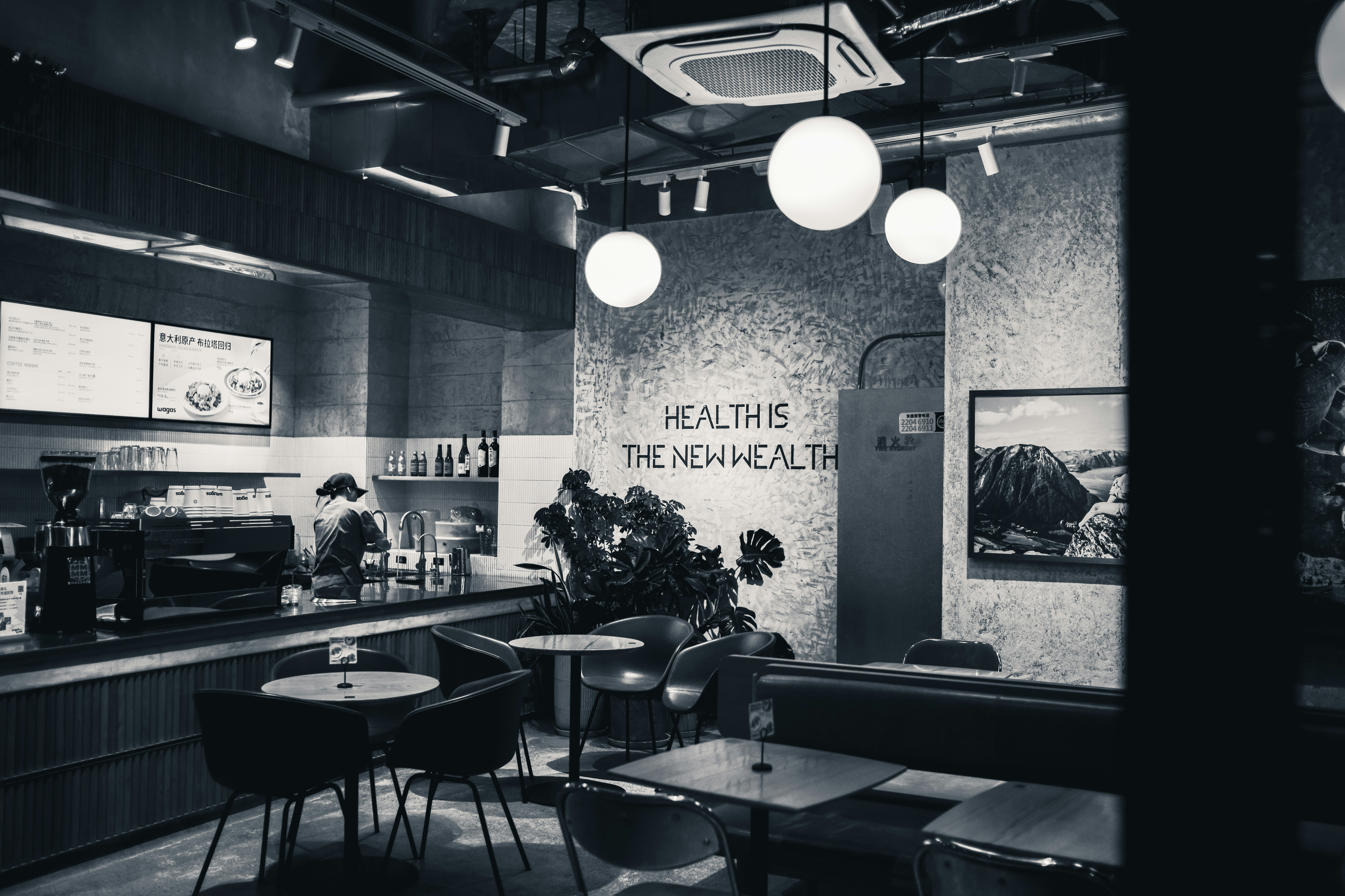 Interior of a modern cafe with seating and counter