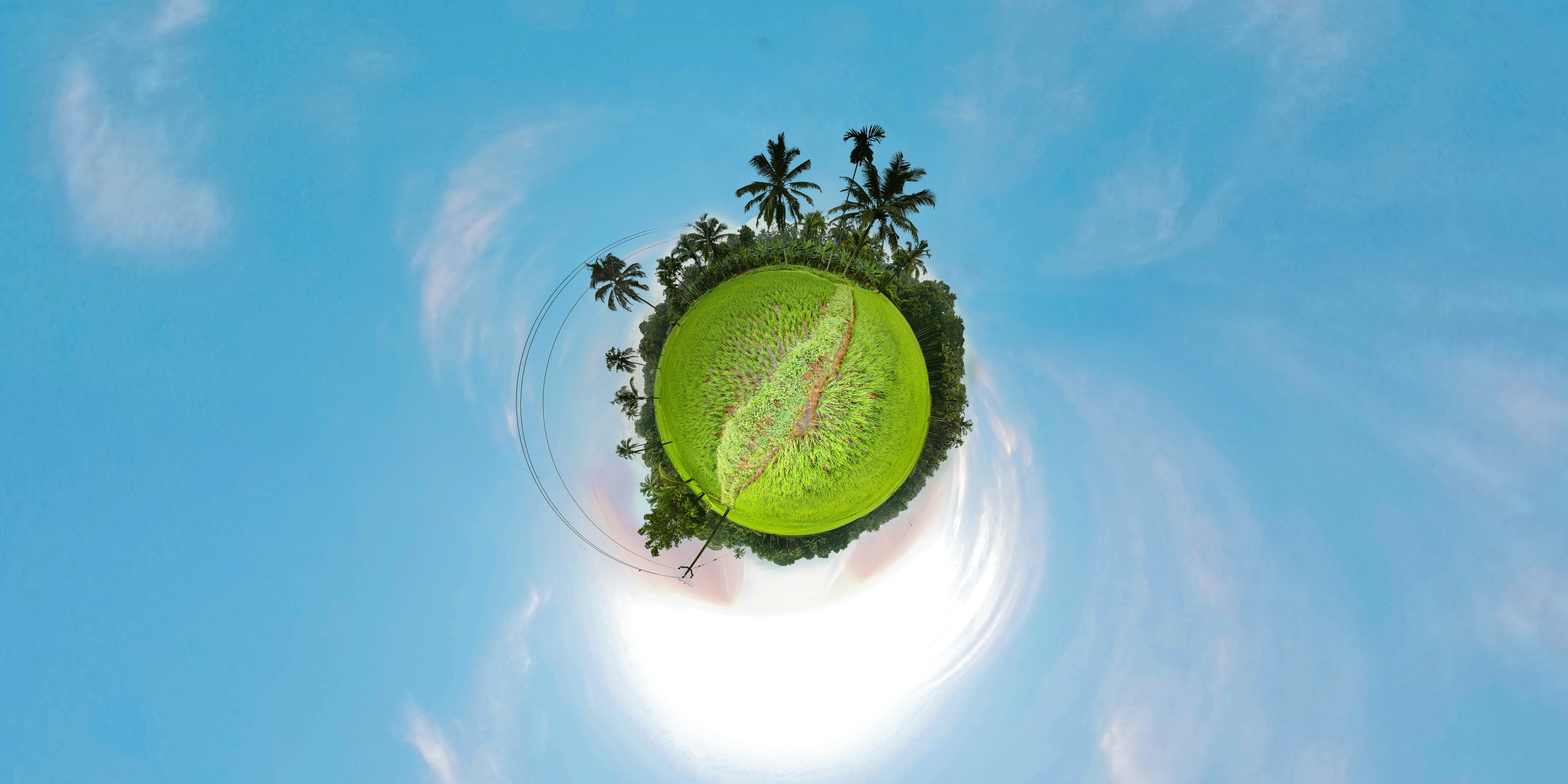 a small island in the middle of a blue sky