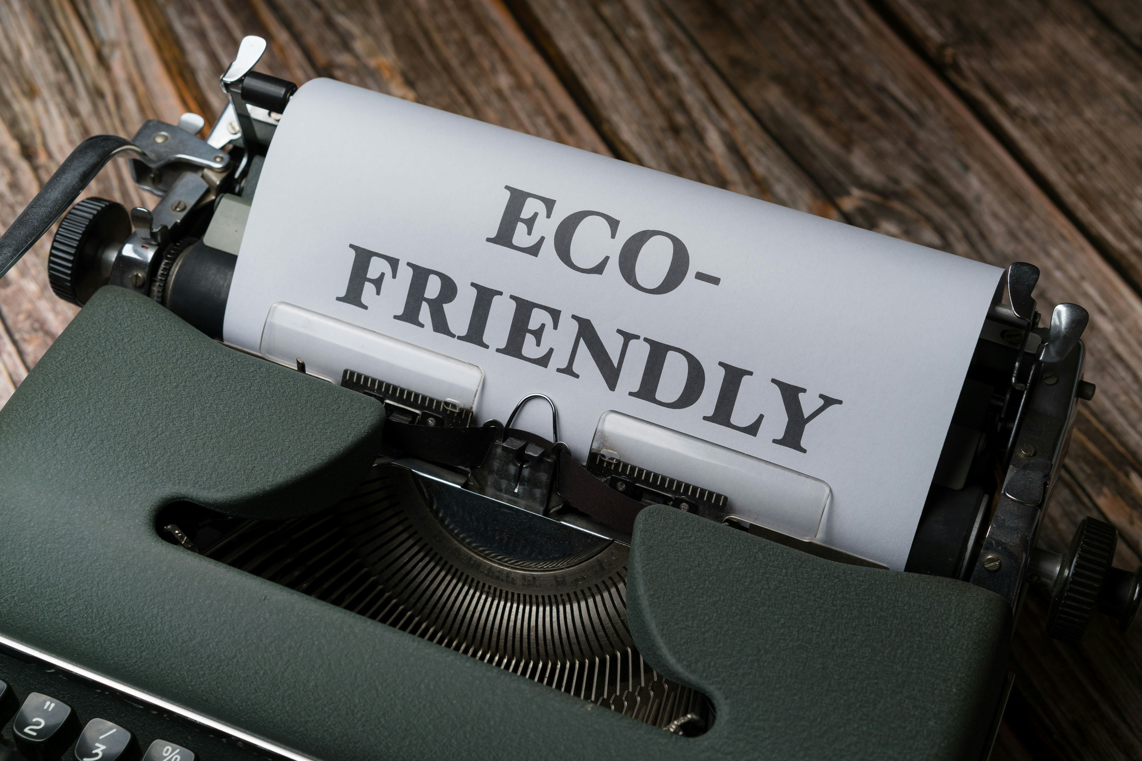 ❓ FAQ by Gone Greenish a close up of a typewriter with a paper that reads eco - friendly