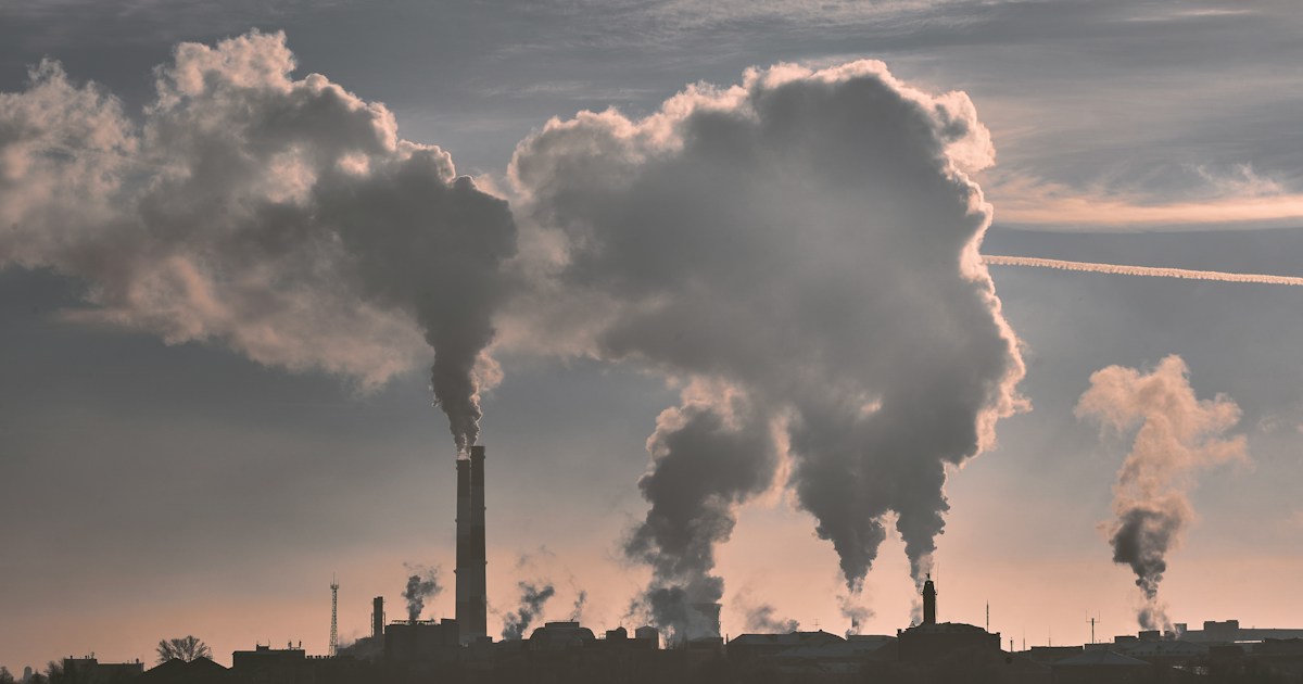 Industrial winter landscape by Gone Greenish silhouette of building under white clouds during daytime